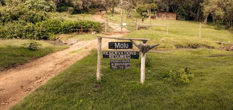 The Malu sign beside the track into the reserve
